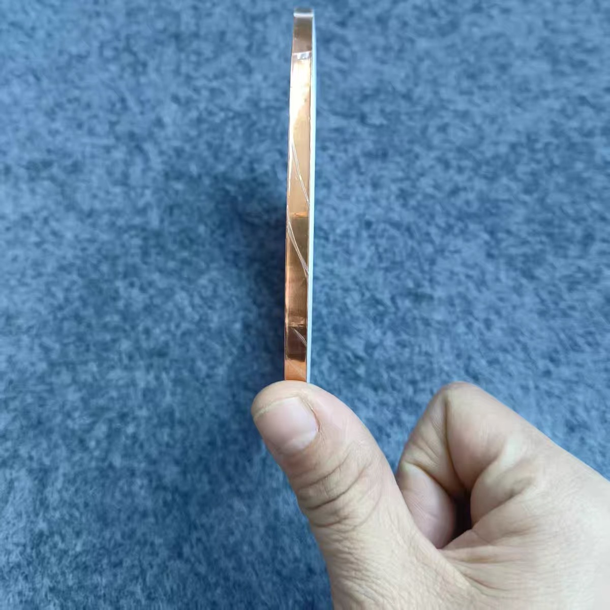 Copper foil strip held edge-on