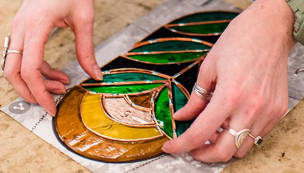 Finished stained glass panel with copper foil seams